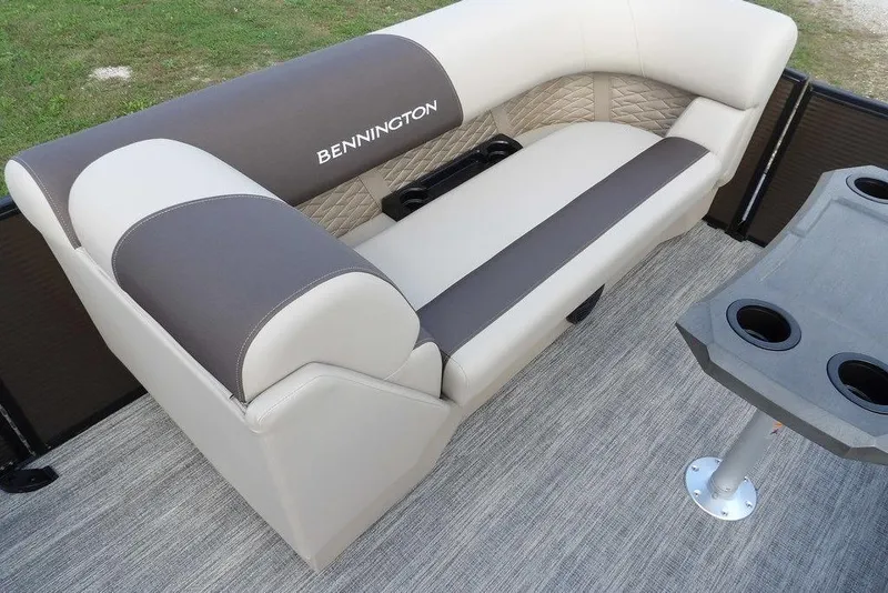 Slide: The Image of 2026 Bennington S Swingback 22 SSB boat interior with cushioned seating and cup holders. - 15