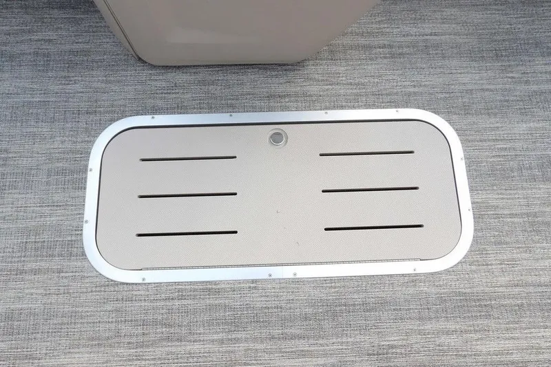 Slide: The Image of 2026 Bennington S Swingback 22 SSB boat floor hatch on textured surface. - 17
