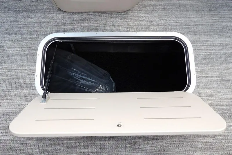 Slide: The Image of Open storage compartment on 2026 Bennington S Swingback 22 SSB boat. - 18