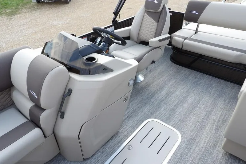 Slide: The Image of 2026 Bennington S Swingback 22 SSB interior with plush seating and modern helm design. - 19