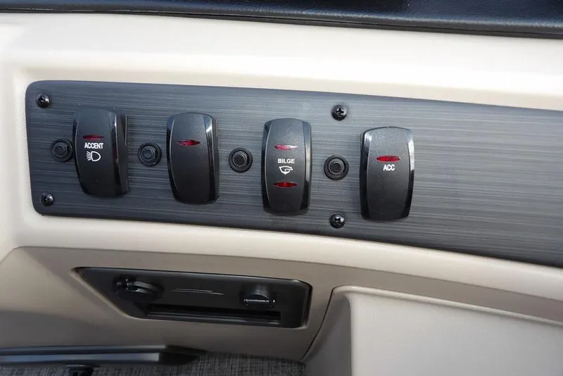 Slide: The Image of Control panel of 2026 Bennington S Swingback 22 SSB with accent, bilge, and accessory switches. - 29
