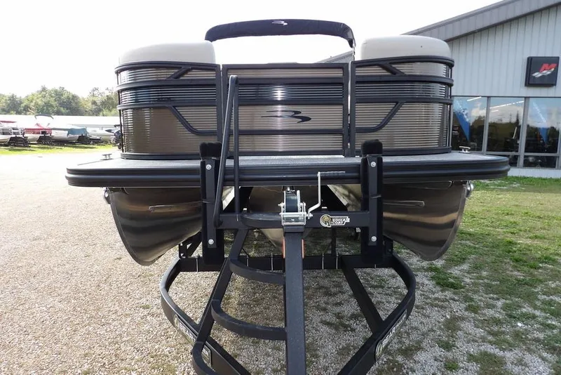 Slide: The Image of 2026 Bennington S Swingback 22 SSB pontoon boat on trailer, outdoor display. - 4