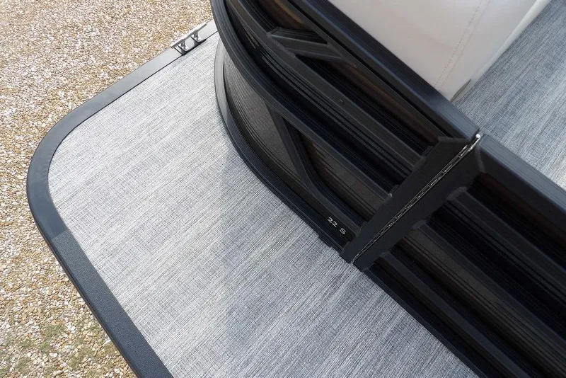 Slide: The Image of 2026 Bennington S Swingback 22 SSB boat deck with sleek black railing design. - 5