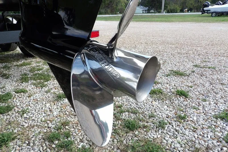 Slide: The Image of 2026 Bennington S Swingback 22 SSB boat propeller on gravel surface. - 58