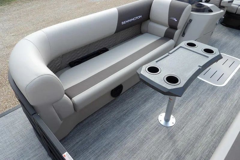 Slide: The Image of 2026 Bennington S Swingback 22 SSB boat interior with seating and cupholder table. - 6