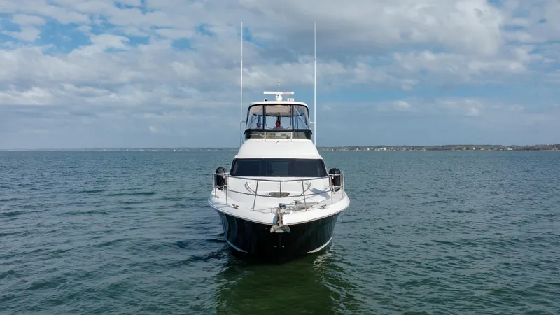 Slide: The Image of 2008 Sea Ray 52 Sedan Bridge yacht on open water. - 10