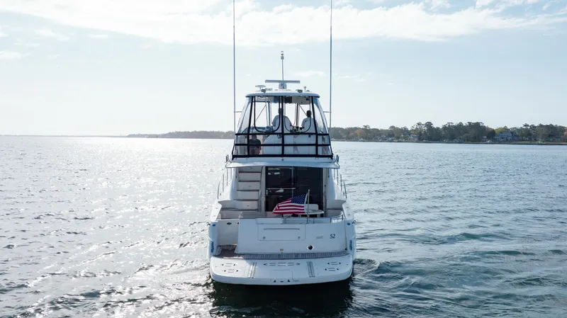 Slide: The Image of 2008 Sea Ray 52 Sedan Bridge yacht on open water. - 18