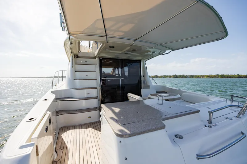 Slide: The Image of 2008 Sea Ray 52 Sedan Bridge yacht with spacious deck and ocean view. - 21