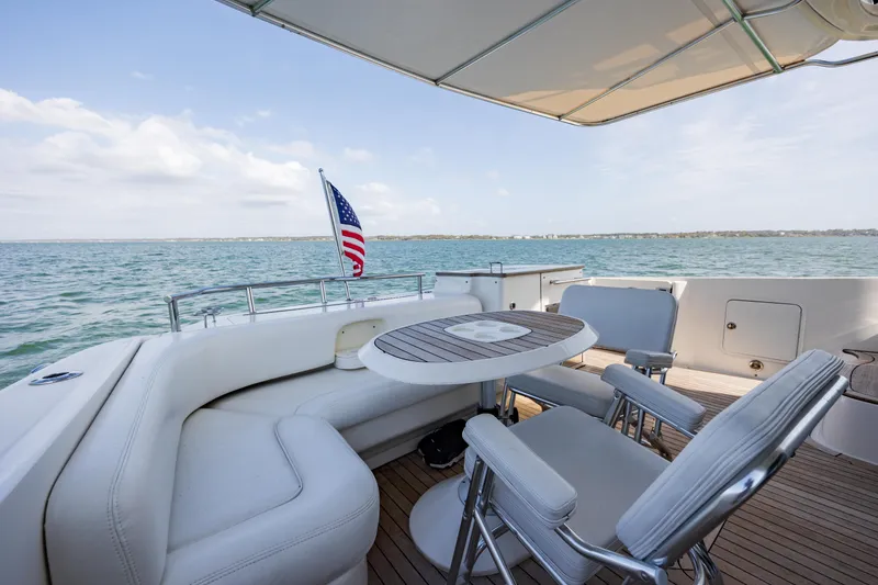 Slide: The Image of 2008 Sea Ray 52 Sedan Bridge yacht with outdoor seating and ocean view. - 25