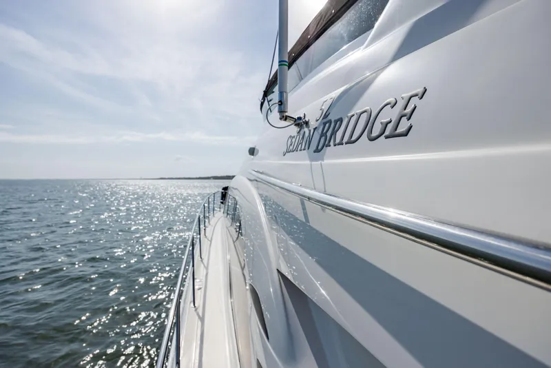 Slide: The Image of 2008 Sea Ray 52 Sedan Bridge yacht cruising on open water. - 27