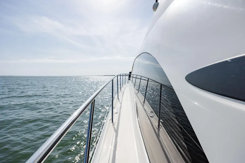 Slide: The Image of Side view of a 2008 Sea Ray 52 Sedan Bridge yacht on open water. - 28