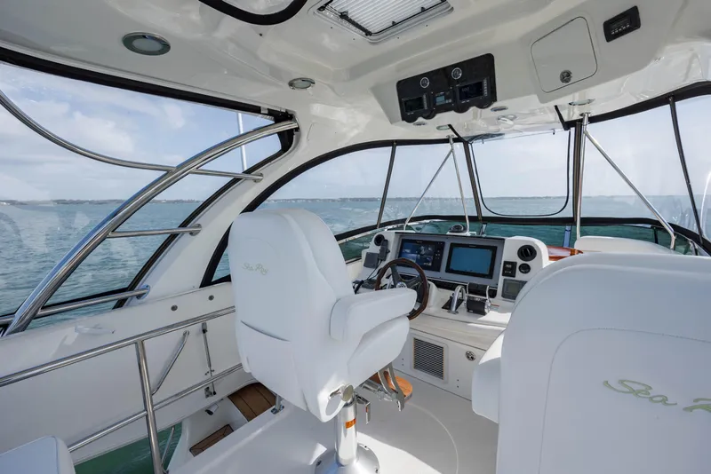 Slide: The Image of 2008 Sea Ray 52 Sedan Bridge helm with modern navigation equipment and panoramic ocean view. - 34