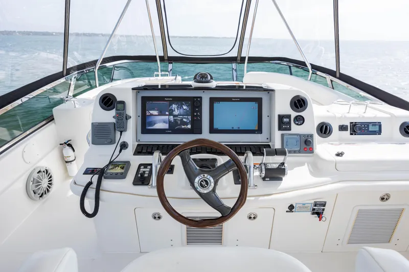 Slide: The Image of Cockpit of a 2008 Sea Ray 52 Sedan Bridge yacht with advanced navigation systems. - 36
