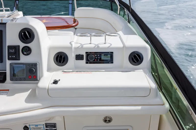 Slide: The Image of 2008 Sea Ray 52 Sedan Bridge helm station with navigation controls and stereo system. - 37