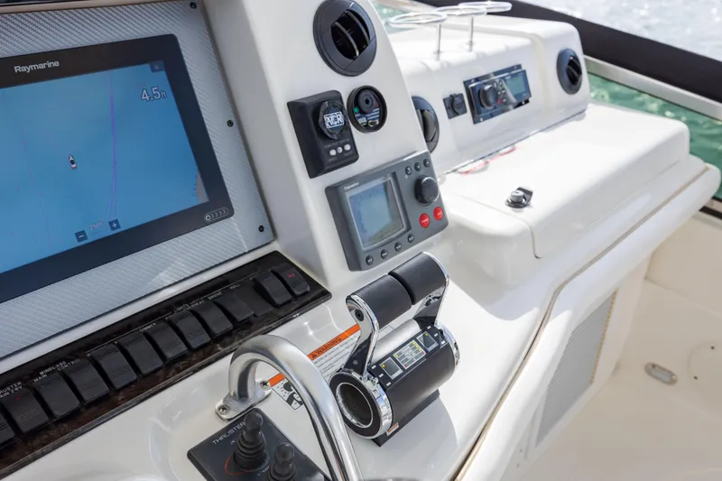 Slide: The Image of 2008 Sea Ray 52 Sedan Bridge helm with navigation and control systems. - 39