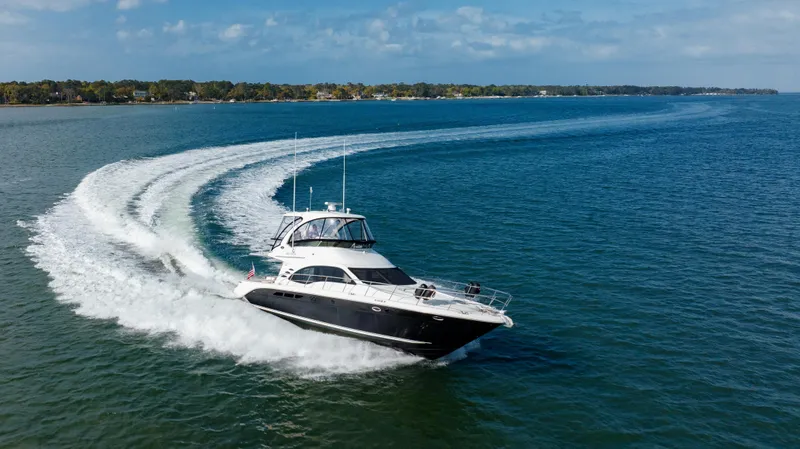 Slide: The Image of 2008 Sea Ray 52 Sedan Bridge cruising on open water. - 4