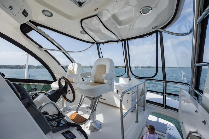 Slide: The Image of Interior view of 2008 Sea Ray 52 Sedan Bridge yacht with helm and seating. - 40