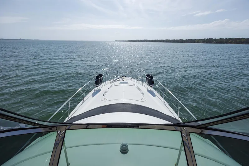 Slide: The Image of 2008 Sea Ray 52 Sedan Bridge cruising on open water. - 47