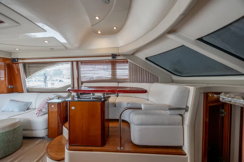 Slide: The Image of Luxurious interior of 2008 Sea Ray 52 Sedan Bridge yacht with elegant seating. - 49