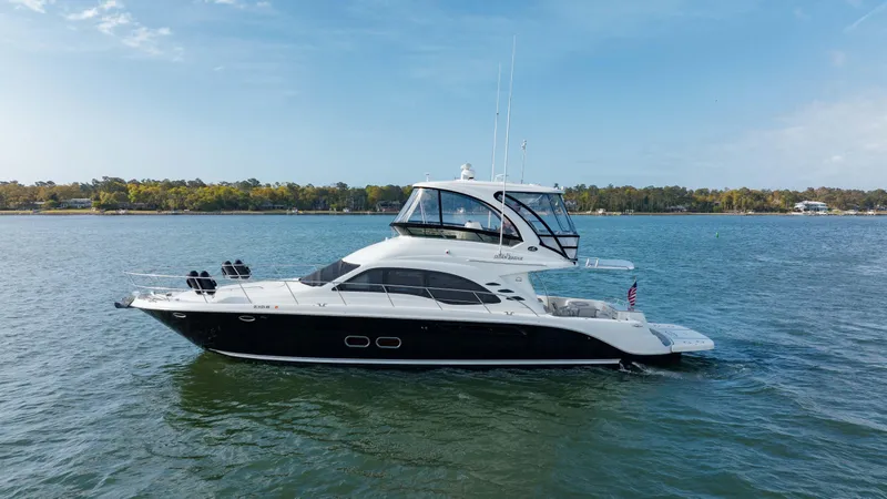 Slide: The Image of 2008 Sea Ray 52 Sedan Bridge yacht cruising on a calm lake. - 8