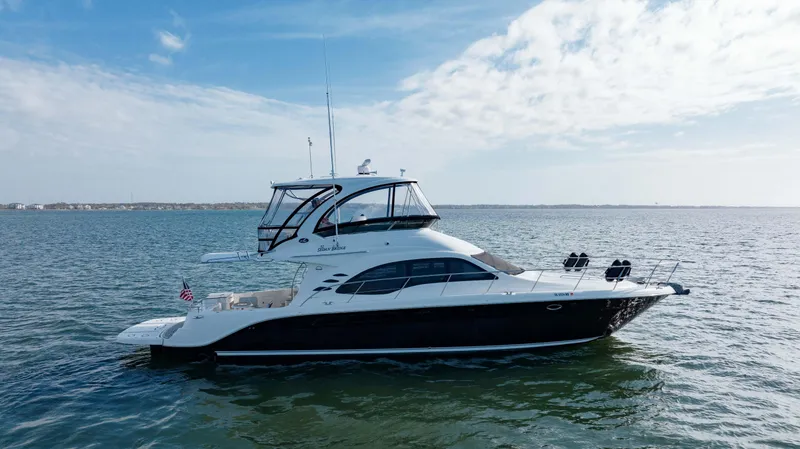 Slide: The Image of 2008 Sea Ray 52 Sedan Bridge yacht on open water. - 9