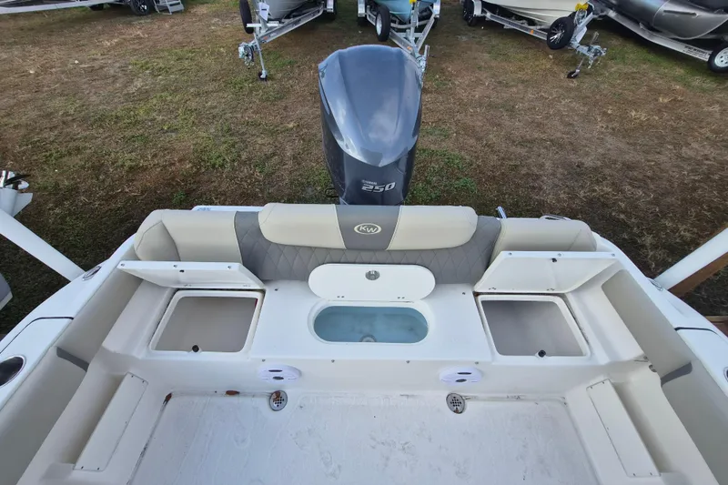 Slide: The Image of 2026 Key West 239 FS boat interior with seating and storage compartments. - 12