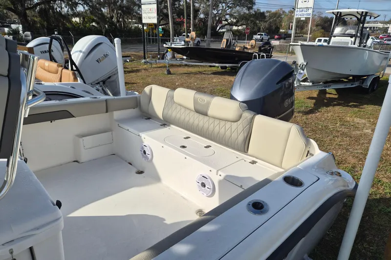 Slide: The Image of 2026 Key West 239 FS boat interior with Yamaha engine, displayed outdoors. - 7