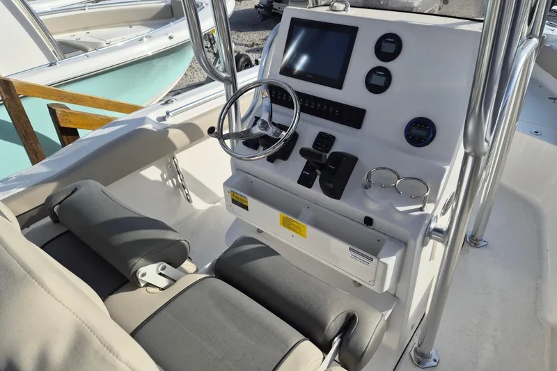 Slide: The Image of 2026 Key West 239 FS boat console with steering wheel and controls. - 8