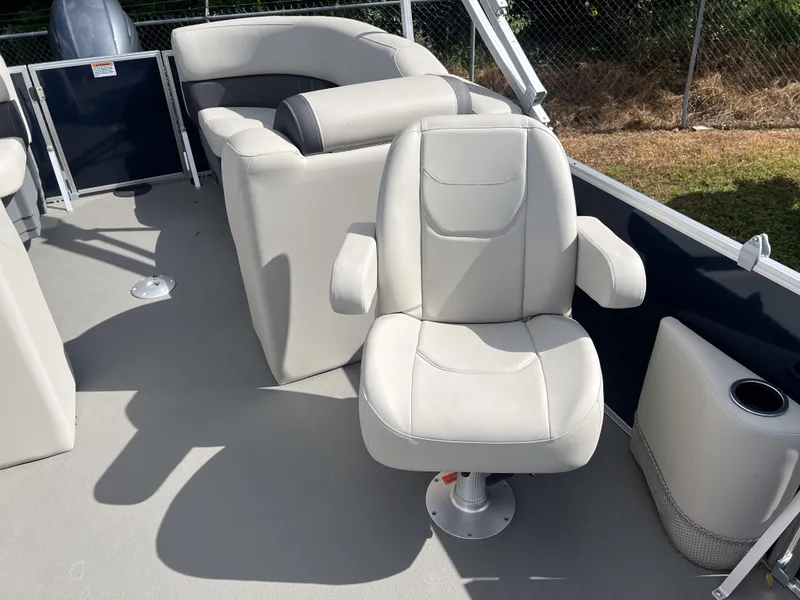 Slide: The Image of 2025 Sylvan Mirage 822 LZ boat interior with plush seating and modern design. - 10
