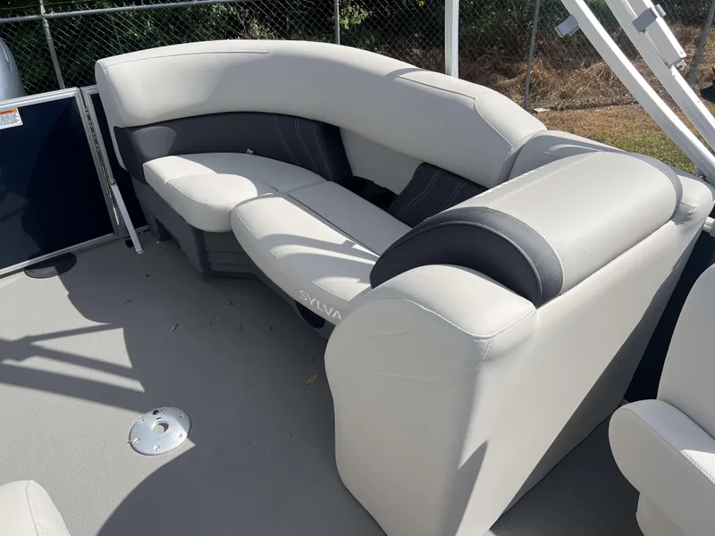 Slide: The Image of 2025 Sylvan Mirage 822 LZ boat interior with plush seating. - 12