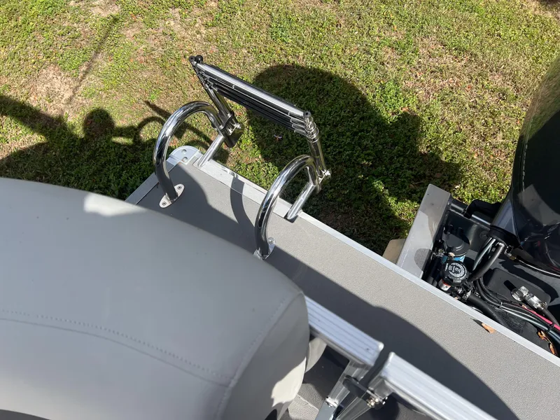 Slide: The Image of Sylvan Mirage 822 LZ 2025 boat ladder and seating, viewed from above on grass. - 15