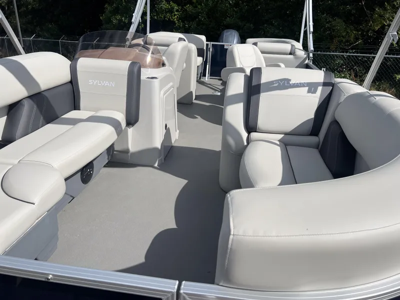 Slide: The Image of 2025 Sylvan Mirage 822 LZ pontoon boat with spacious seating and modern design. - 4
