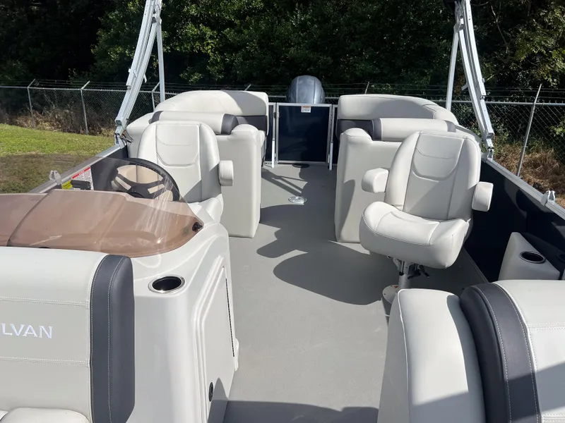 Slide: The Image of 2025 Sylvan Mirage 822 LZ pontoon boat with spacious seating and modern design. - 7