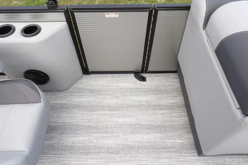 Slide: The Image of 2026 Bennington S Swingback 21 SSB interior with gray seating and flooring. - 27