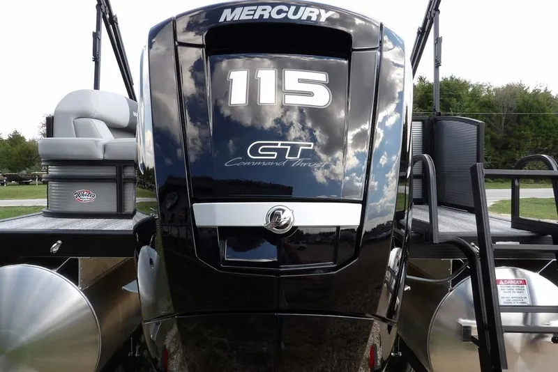 Slide: The Image of 2026 Bennington S Swingback 21 SSB with Mercury 115 outboard engine, outdoor setting. - 51