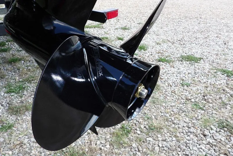 Slide: The Image of Close-up of a 2026 Bennington S Swingback 21 SSB boat propeller on gravel. - 52