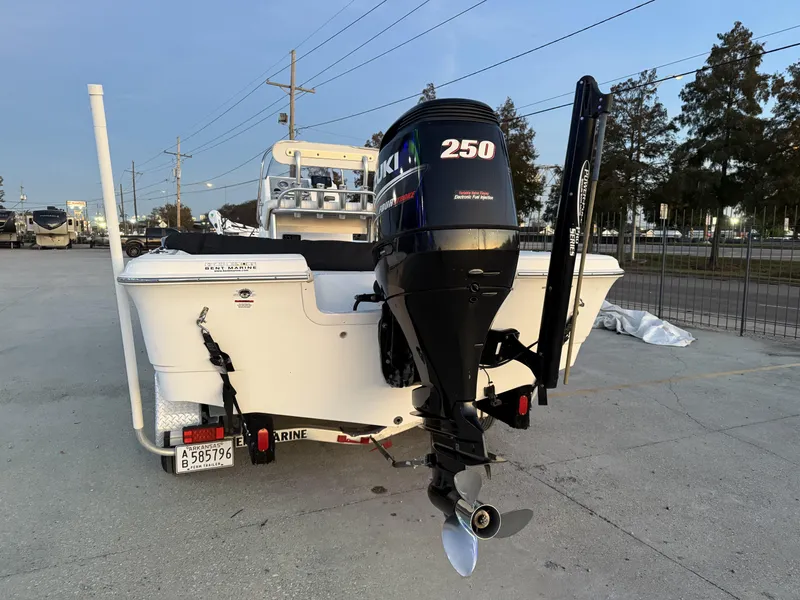 Slide: The Image of 2006 Sea Fox Bay Fisher 225 boat with Suzuki 250 outboard motor, parked outdoors. - 4