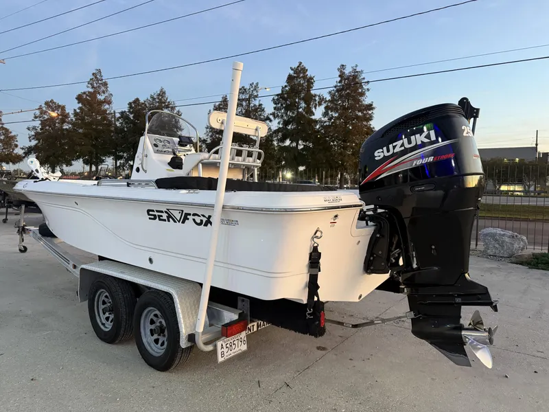 Slide: The Image of 2006 Sea Fox Bay Fisher 225 boat with Suzuki outboard motor on trailer. - 5