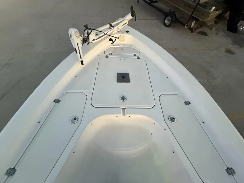 Slide: The Image of 2006 Sea Fox Bay Fisher 225 boat deck with trolling motor, spacious storage compartments. - 7