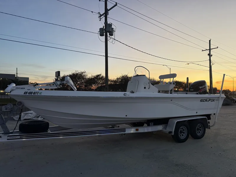 Slide: The Image of 2006 Sea Fox Bay Fisher 225 boat on trailer at sunset. - 9
