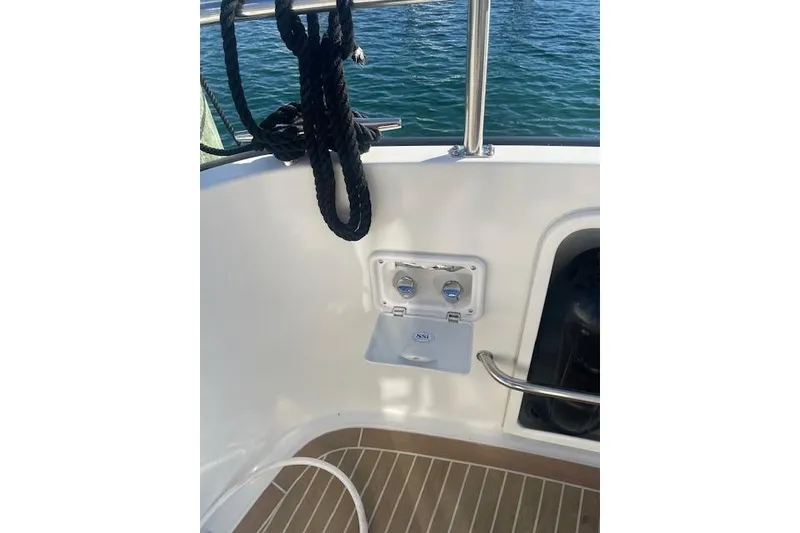 Slide: The Image of Nordic Tug 42 boat deck with rope and water access panel, 2006 model. - 12