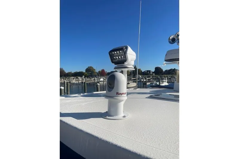 Slide: The Image of Raymarine equipment on 2006 Nordic Tug 42 boat deck, marina background, clear blue sky. - 20