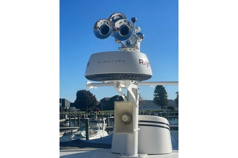 Slide: The Image of Radar and horn system on a 2006 Nordic Tug 42 boat under clear blue sky. - 21