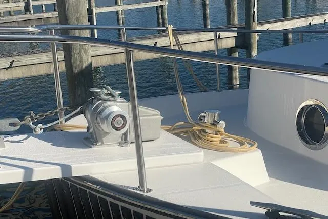Slide: The Image of Nordic Tug 42 (2006) boat deck with winch and railing at marina. - 3