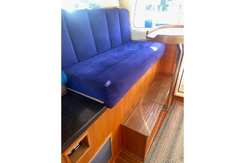Slide: The Image of Blue cushioned seating in 2006 Nordic Tug 42 boat interior. - 40