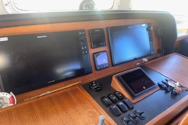 Slide: The Image of Pilothouse of 2006 Nordic Tug 42 with navigation screens and controls. - 42