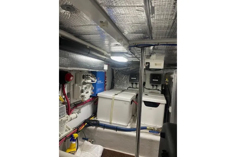 Slide: The Image of Engine room of a 2006 Nordic Tug 42 with equipment and wiring. - 62