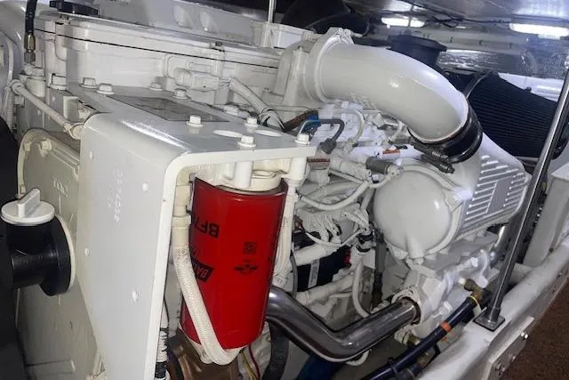 Slide: The Image of Engine compartment of a 2006 Nordic Tug 42, showcasing detailed mechanical components. - 64