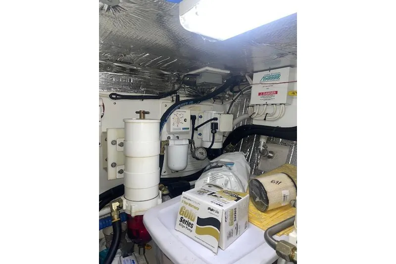 Slide: The Image of Engine room of a 2006 Nordic Tug 42 with filters and equipment. - 70