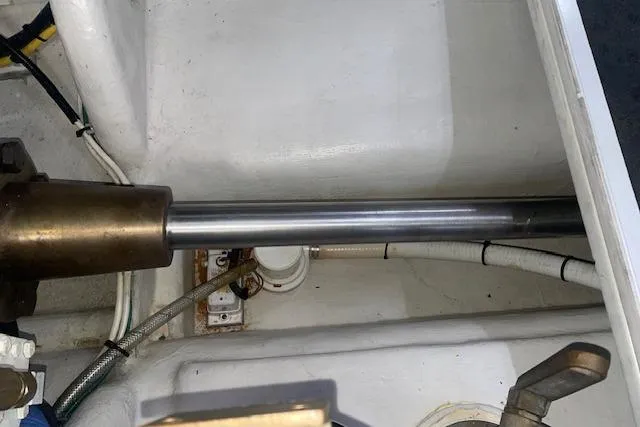 Slide: The Image of Engine compartment of a 2006 Nordic Tug 42, showing mechanical components and wiring. - 73